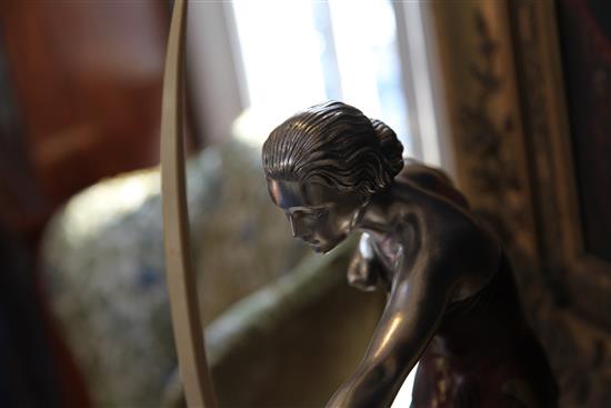 A French Art Deco silvered and painted model of a huntress, 23in.